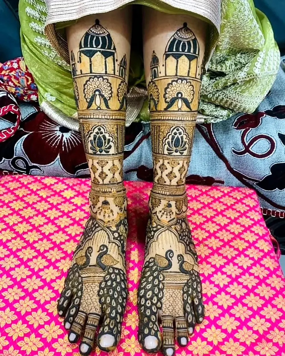 Bridal leg mehndi with dome, lotus and peacock up to the knee