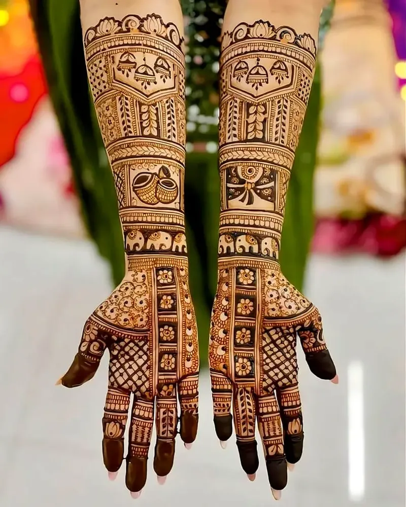 Dark bridal mehandi with kalash and jhumka panels on both arms