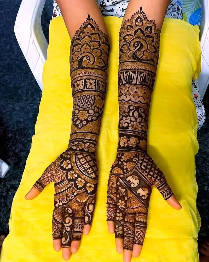 Full bridal mehandi with peacock and floral bands on both hands