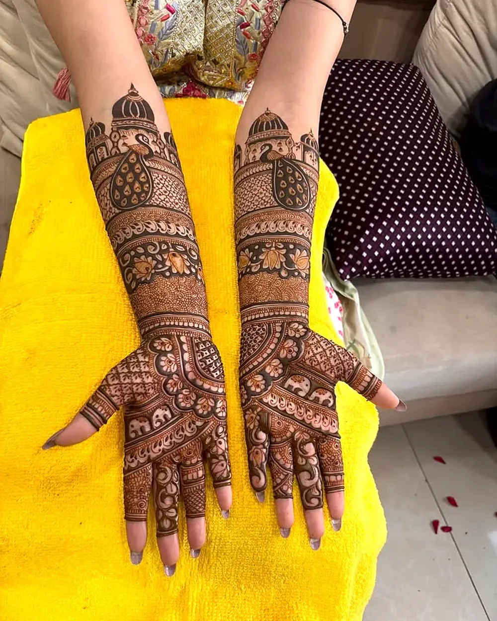 Elbow length bridal mehndi with dome and peacock design