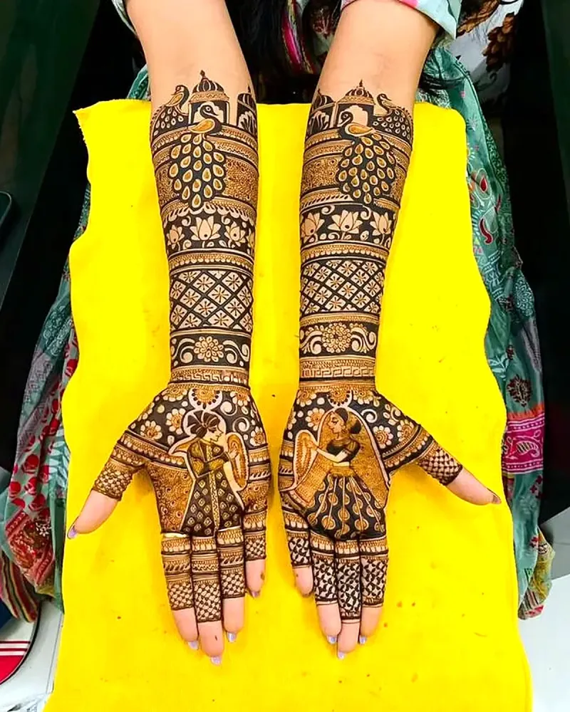 Peacock bridal mehndi with couple figures in the palms
