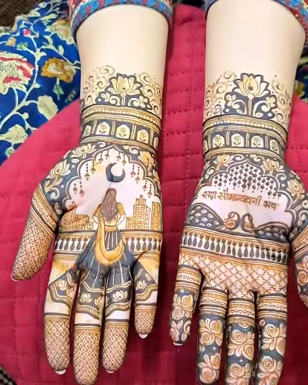 Karwa Chauth mehendi with crescent moon, city skyline and a blessing written on both palms